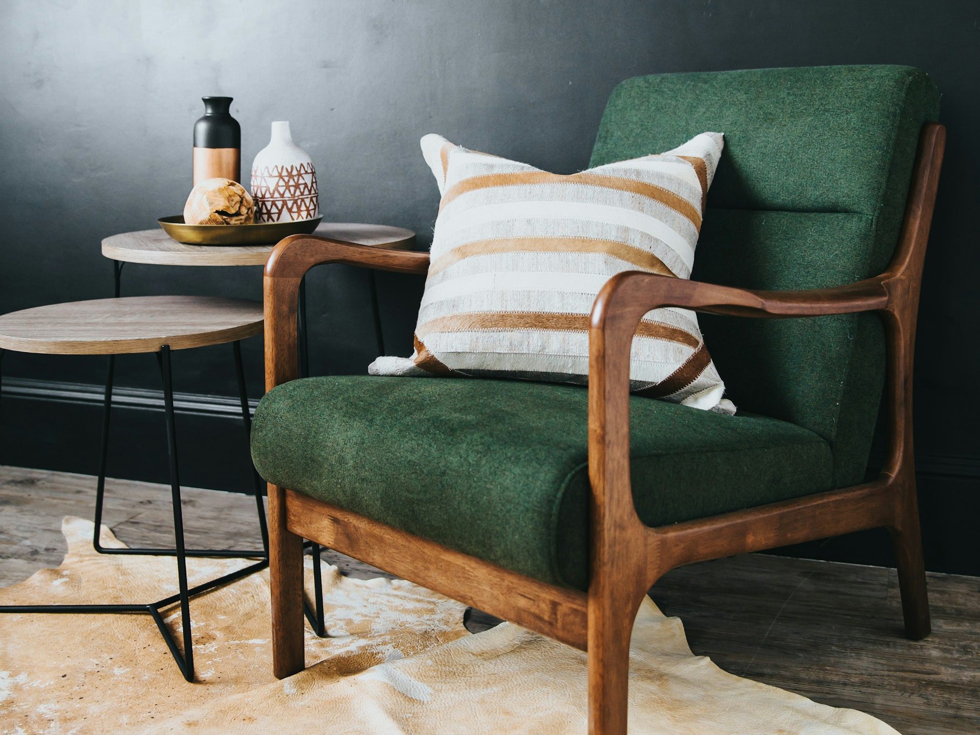 white throw pillow on green sofa chair