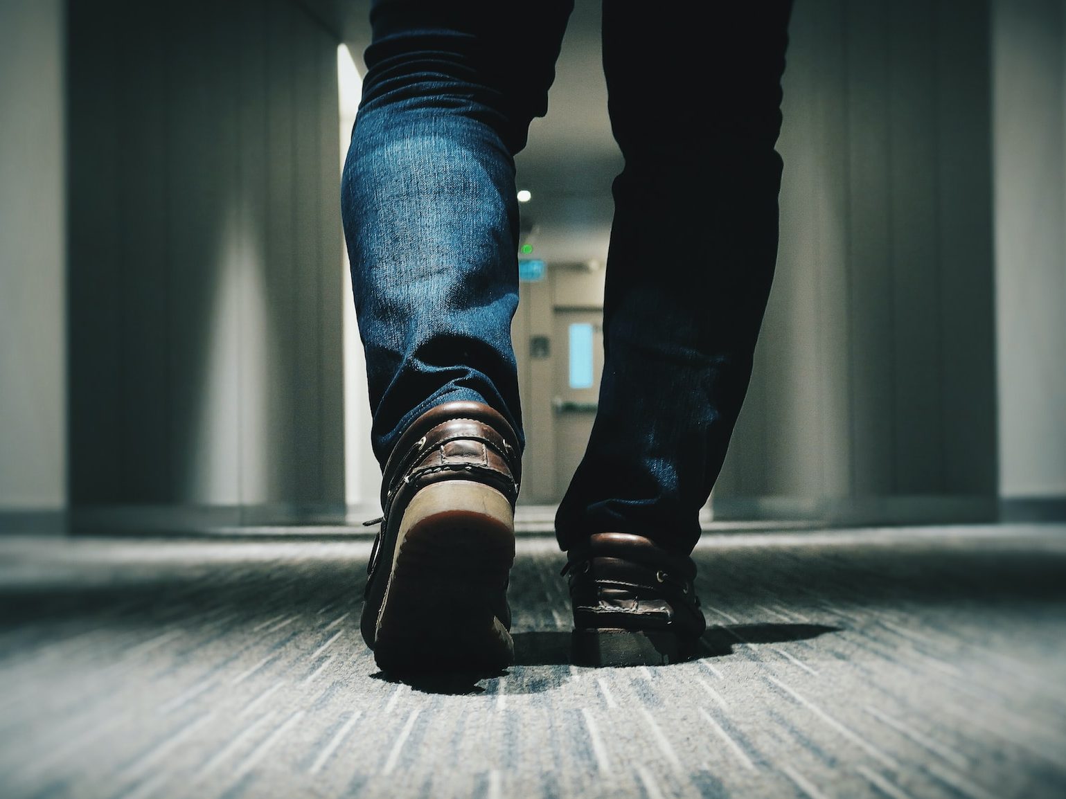 person walking on room